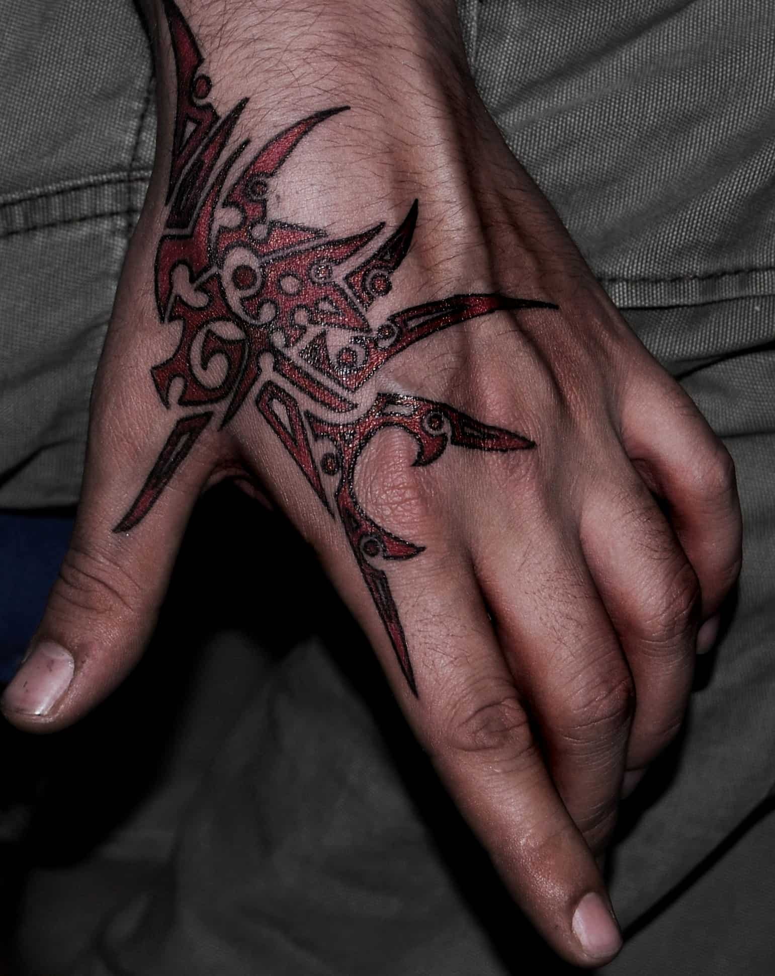 Tribal tattoo shark tattoo on hand