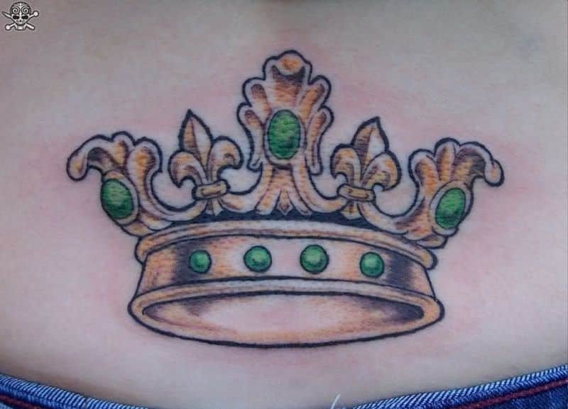 crown tattoo on lower back