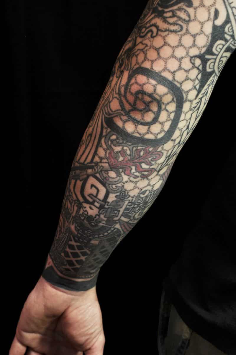 grey ink geometric dotwork elbow tattoo