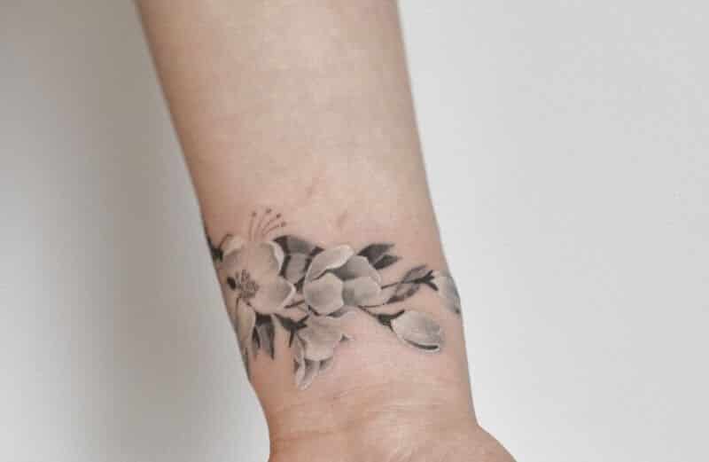 Black And White Flower Wrist Tattoos