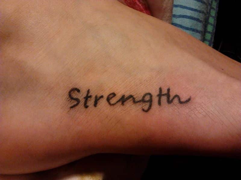 Strength Tattoo On Right Foot